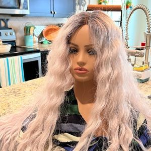 Brand new with tags synthetic wig. Taken out of the box to try on for pictures.